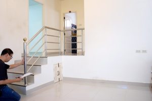 The landlord is doing regular property assessments to ensure and maintain the condition of his rental property.