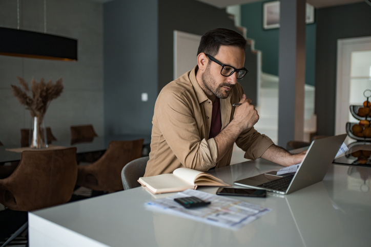 A landlord reviewing rental property tax write-offs in Alberta.