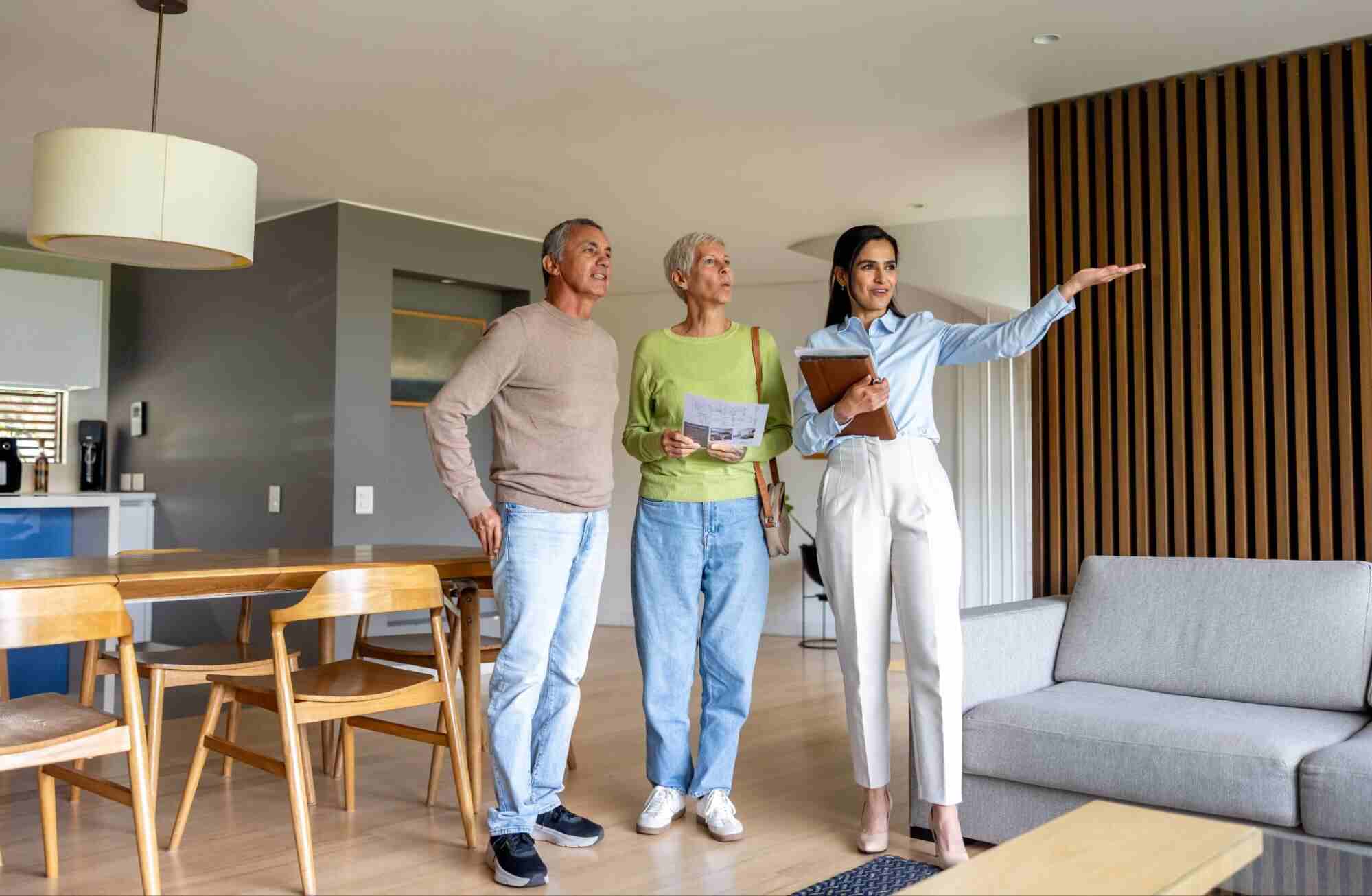 Prospective renters touring a modern apartment with a real estate professional, highlighting Canada rental market trends and changing housing demand.